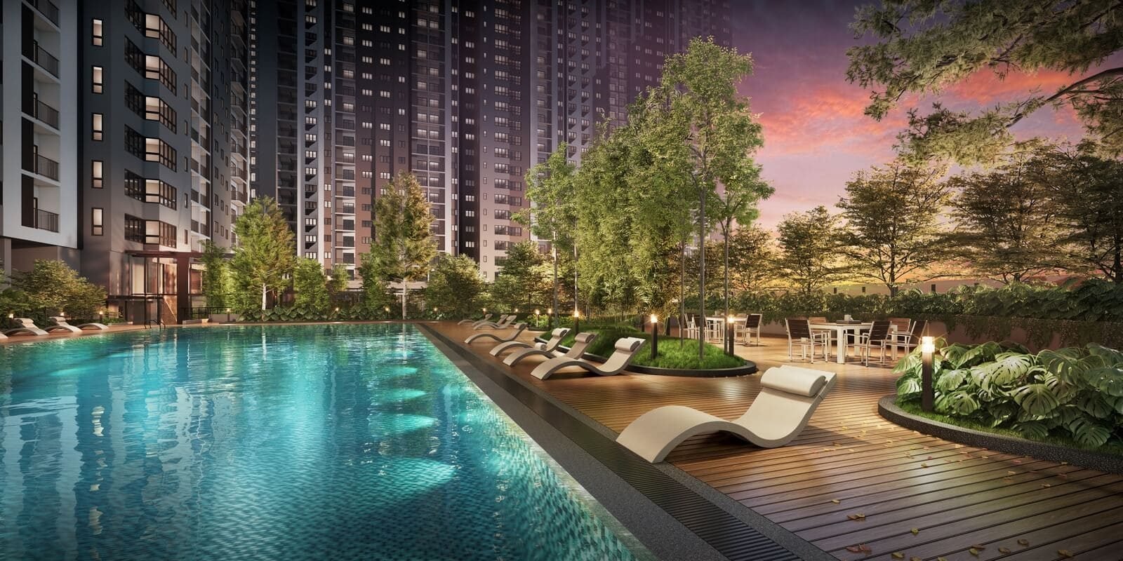 Aster Hill Sri Petaling swimming pool with timber sun deck, loungers and landscaped gardens at dusk