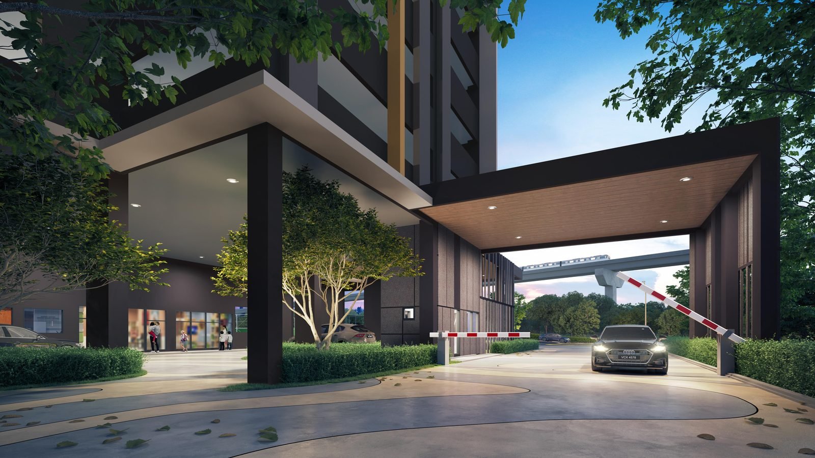 D'Evia Residences Kwasa Damansara covered grand entrance and drop-off with the MRT viaduct beyond, at dusk