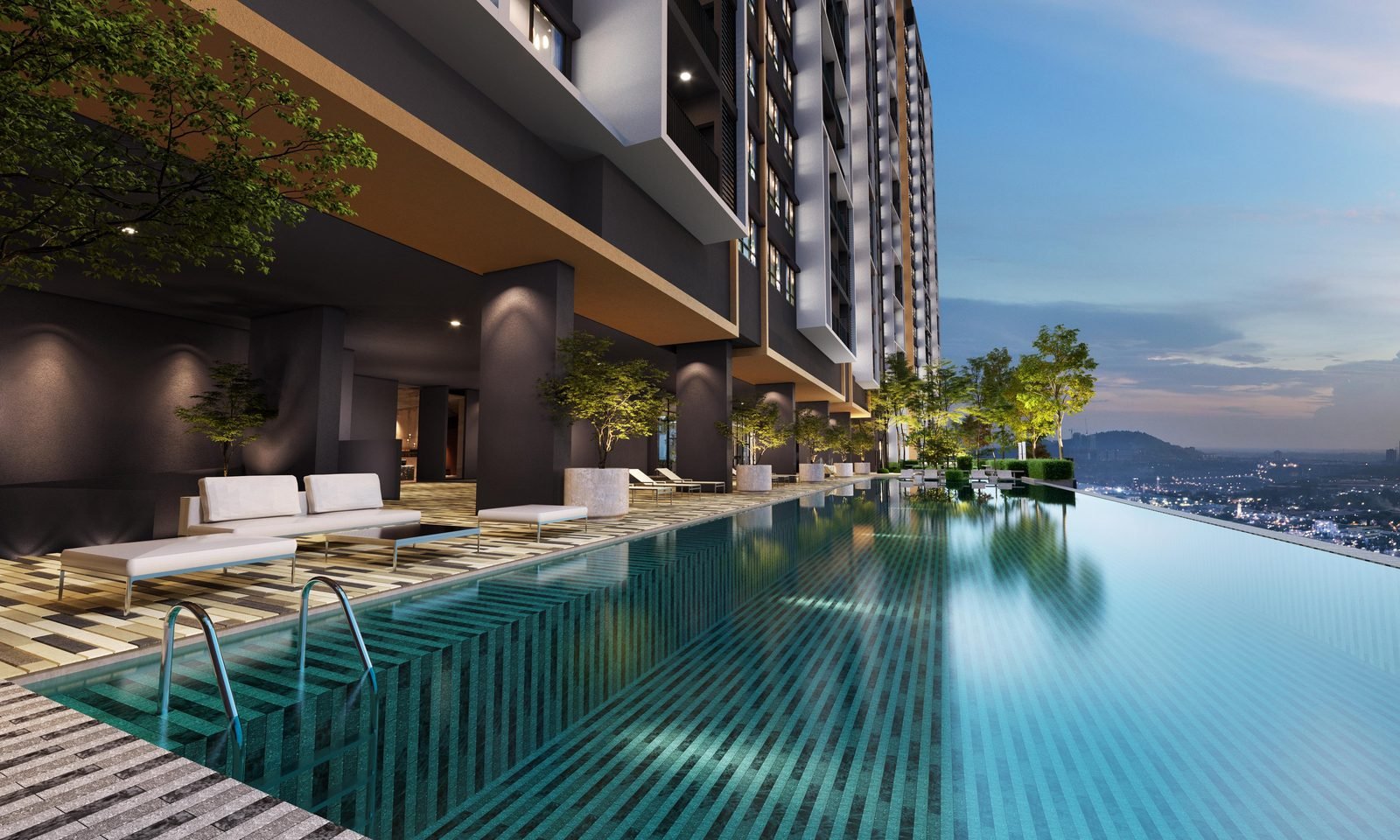 D'Evia Residences Kwasa Damansara infinity-edge swimming pool and sun deck with elevated city views at dusk