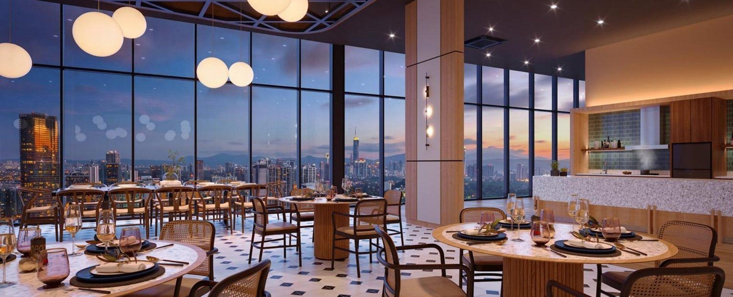 Lunar Seputeh sky dining lounge with floor-to-ceiling views of the KL skyline at dusk