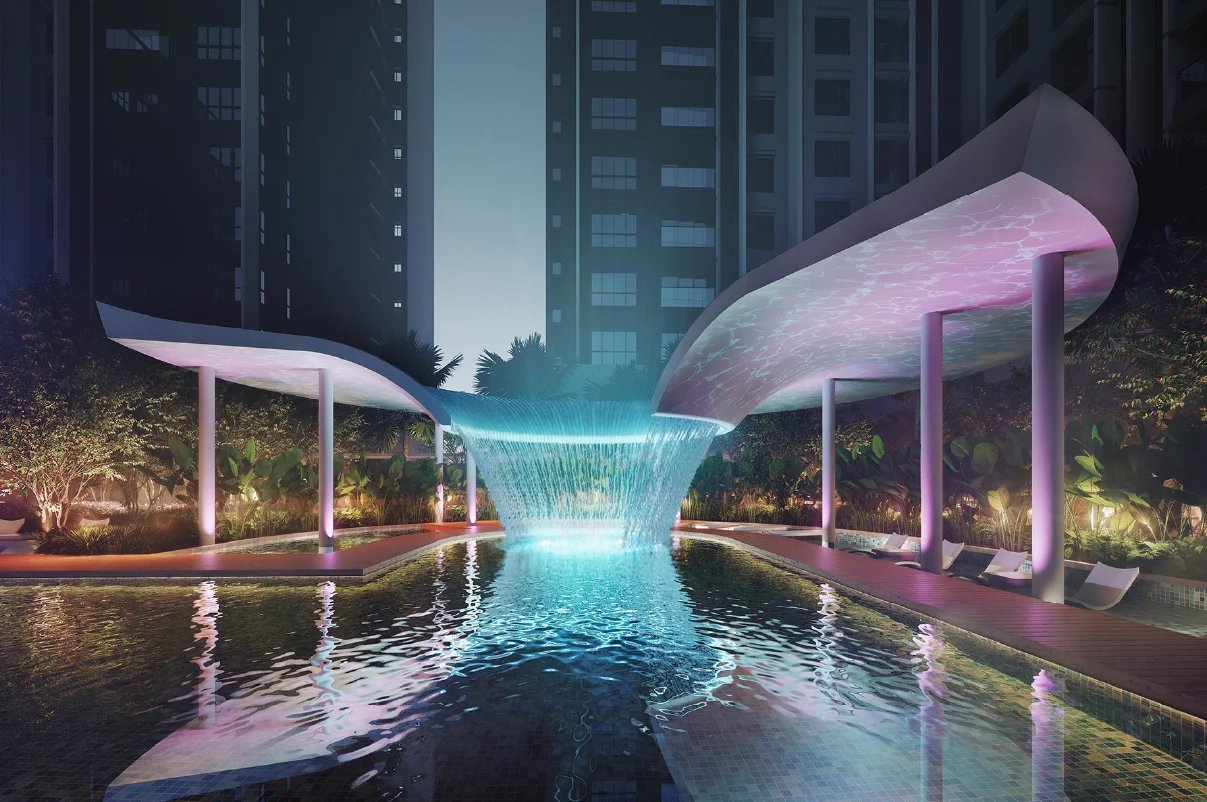Trinity Rainfora infinity pool with lit waterfall pavilions at night