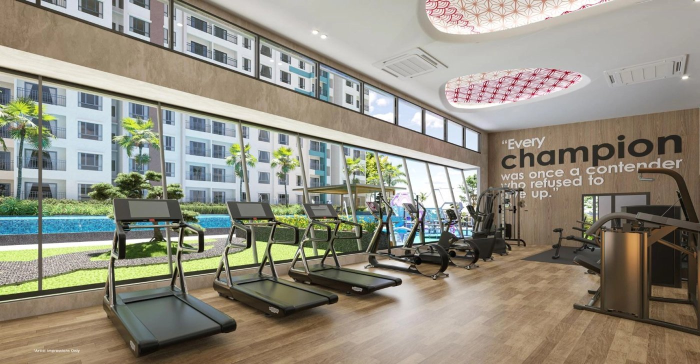 Riverville 2 Residences gymnasium with treadmills overlooking the pool and gardens